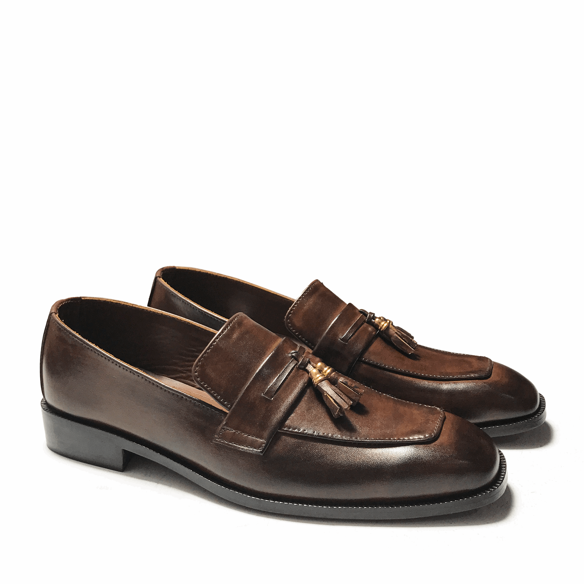 STRAPED BROWN SLIP-ONS