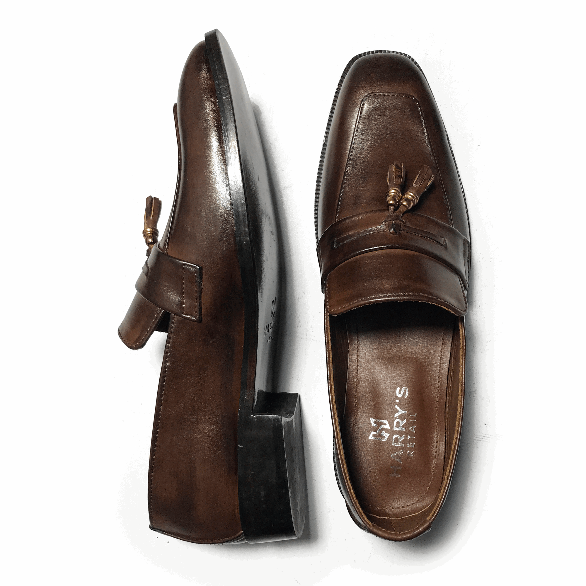 STRAPED BROWN SLIP-ONS