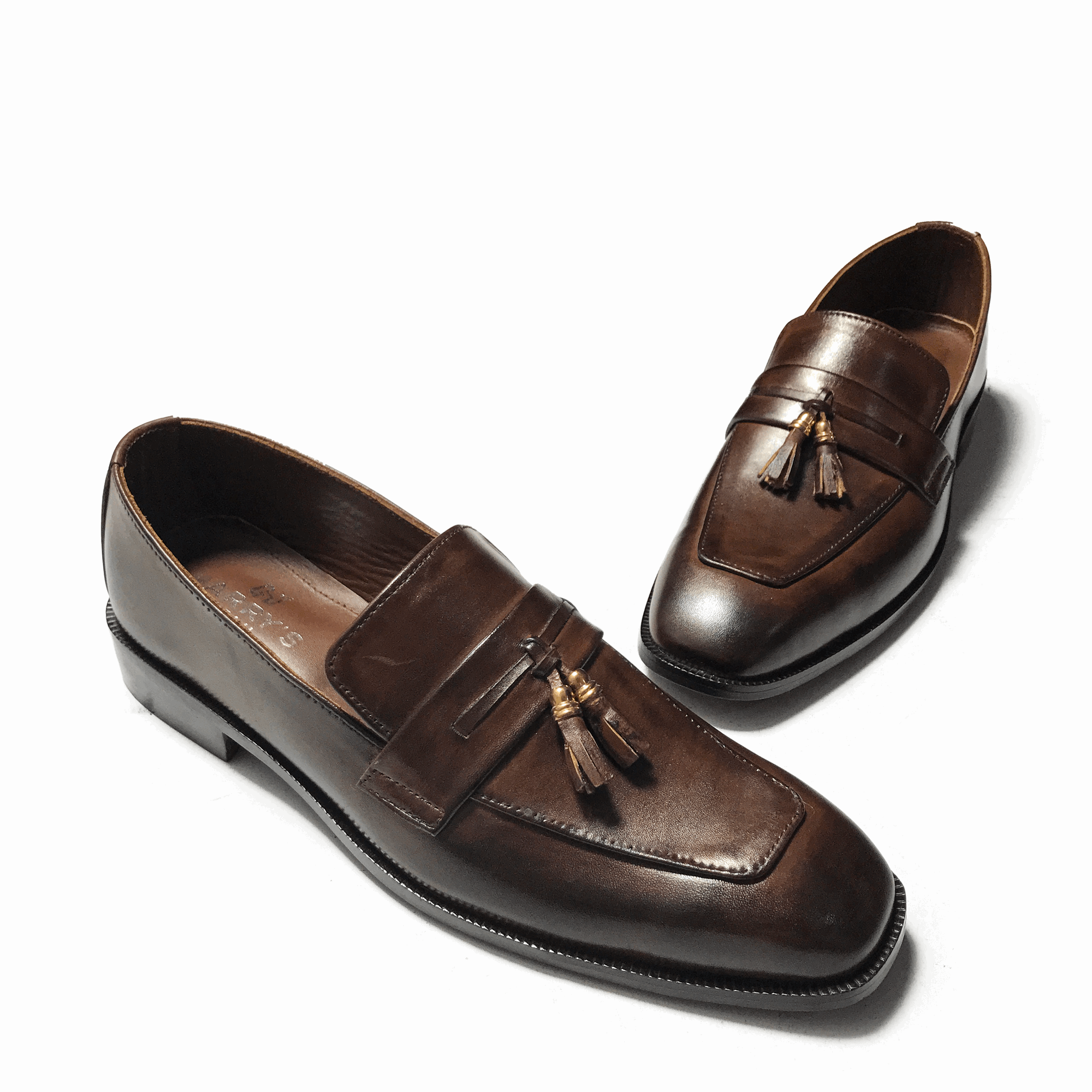 STRAPED BROWN SLIP-ONS